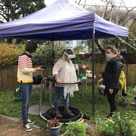 Lady wearing VR headset in garden